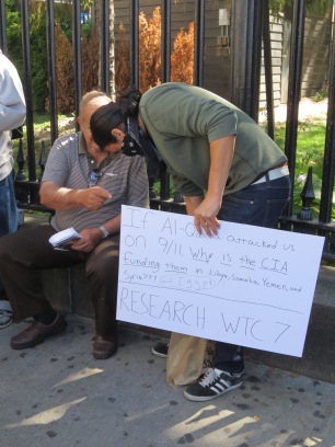 A truther adding more to his sign